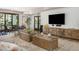 A modern clubhouse with a lounge area that includes a TV, seating, and stylish decor at 2511 W Queen Creek Rd # 378, Chandler, AZ 85248