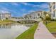 Picturesque community featuring walking paths, lush landscaping, a waterway, and well maintained buildings at 2511 W Queen Creek Rd # 378, Chandler, AZ 85248