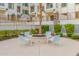 Inviting outdoor fire pit area with seating, perfect for relaxing and enjoying the evening with friends and Gathering at 2511 W Queen Creek Rd # 378, Chandler, AZ 85248