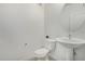 Half bathroom featuring a round mirror and white fixtures at 2511 W Queen Creek Rd # 378, Chandler, AZ 85248