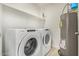 Laundry room with a Whirlpool washer and dryer and a gray hot water tank at 2511 W Queen Creek Rd # 378, Chandler, AZ 85248
