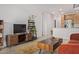 Open-concept layout featuring a living room flowing into the kitchen with modern finishes at 2511 W Queen Creek Rd # 378, Chandler, AZ 85248