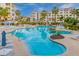 Resort-style pool surrounded by lush landscaping, lounge chairs, and palm trees, creating a relaxing oasis at 2511 W Queen Creek Rd # 378, Chandler, AZ 85248