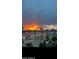 Beautiful sunset over the neighborhood homes and palm trees at 2511 W Queen Creek Rd # 378, Chandler, AZ 85248