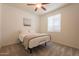 Cozy bedroom with plush carpet, a comfortable bed, and a bright window at 2543 W Rabjohn Rd, Phoenix, AZ 85085