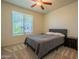 Bedroom features neutral tones, carpet, and bright window at 2543 W Rabjohn Rd, Phoenix, AZ 85085