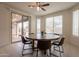 Bright dining area with sliding glass door and a round table at 2543 W Rabjohn Rd, Phoenix, AZ 85085