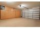 Spacious garage features built-in cabinets for ample storage, and an epoxy floor for durability and easy maintenance at 2543 W Rabjohn Rd, Phoenix, AZ 85085