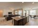 Spacious kitchen and living area with a granite island at 2543 W Rabjohn Rd, Phoenix, AZ 85085