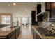 Modern kitchen with granite countertops and a view to the backyard at 2543 W Rabjohn Rd, Phoenix, AZ 85085
