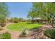 Neighborhood park features a manicured lawn, shade structure and walking paths at 2543 W Rabjohn Rd, Phoenix, AZ 85085