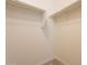 Walk-in closet featuring upper shelving and racks at 2543 W Rabjohn Rd, Phoenix, AZ 85085