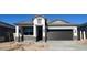 Charming single-story home with a well-manicured front yard and a two-car garage at 25467 W Graham Trl, Buckeye, AZ 85326