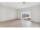 Bright living room with sliding glass doors leading to the backyard at 25479 W Graham Trl, Buckeye, AZ 85326