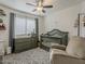 Charming Bedroom with crib, dresser, patterned rug and ceiling fan, perfect for a new baby at 2550 E Caballero St, Mesa, AZ 85213