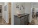 Hallway displaying a gray console table with neutral wall decor at 2550 E Caballero St, Mesa, AZ 85213
