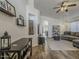 Bright and airy living room with hardwood floors, neutral colors, and an open layout to the dining area at 2550 E Caballero St, Mesa, AZ 85213