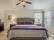 Well-lit main bedroom with wood floors and large windows offering ample natural light at 2550 E Caballero St, Mesa, AZ 85213