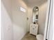 A powder bathroom with a mirror above the sink at 3221 N 37Th St # 26, Phoenix, AZ 85018