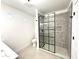 Modern bathroom with gray tiling, glass shower, and neutral color palette at 3221 N 37Th St # 26, Phoenix, AZ 85018