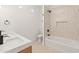 Well-lit bathroom featuring a bathtub and double sink vanity with white countertops at 3221 N 37Th St # 26, Phoenix, AZ 85018