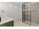 Updated bathroom featuring a large walk-in shower with glass doors and a modern double sink vanity at 3221 N 37Th St # 26, Phoenix, AZ 85018
