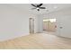 Bright bedroom features a ceiling fan, sliding glass door to patio, and neutral decor at 3221 N 37Th St # 26, Phoenix, AZ 85018