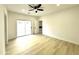 Bright bedroom with ceiling fan and sliding door to patio at 3221 N 37Th St # 26, Phoenix, AZ 85018