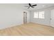 A bedroom with a ceiling fan, a large window, and access to the bathroom at 3221 N 37Th St # 26, Phoenix, AZ 85018