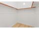 Walk-in closet with simple rod-and-shelf system and neutral color palette at 3221 N 37Th St # 26, Phoenix, AZ 85018