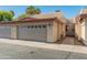 Attached garage to the home with a well-maintained walkway, complementing the desert landscape at 3221 N 37Th St # 26, Phoenix, AZ 85018