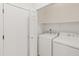 Convenient laundry area with washer and dryer, plus storage shelf, located adjacent to a closet at 3221 N 37Th St # 26, Phoenix, AZ 85018