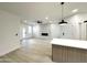 Bright living room with white fireplace and accent wall, and island seating at 3221 N 37Th St # 26, Phoenix, AZ 85018