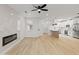 Open concept living area flows seamlessly into the kitchen, featuring a fireplace and ample natural light at 3221 N 37Th St # 26, Phoenix, AZ 85018