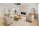 Bright and airy living room with marble fireplace, ceiling fan, neutral furniture, and light wood flooring at 3221 N 37Th St # 26, Phoenix, AZ 85018