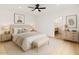 A serene bedroom with a neutral color palette, a ceiling fan, and an ensuite bathroom at 3221 N 37Th St # 26, Phoenix, AZ 85018