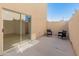 Cozy outdoor patio with sliding glass door access and seating, perfect for relaxation at 3221 N 37Th St # 26, Phoenix, AZ 85018