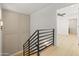 Staircase featuring modern railings and access to a bedroom at 3221 N 37Th St # 26, Phoenix, AZ 85018