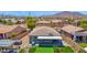 Private backyard with a putting green, hot tub, and outdoor kitchen at 3498 E Ravenswood Dr, Gilbert, AZ 85298