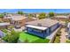 Expansive backyard featuring a putting green, outdoor kitchen, and relaxing hot tub at 3498 E Ravenswood Dr, Gilbert, AZ 85298