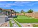 Enjoy outdoor living with a putting green, covered patio, and lush landscaping at 3498 E Ravenswood Dr, Gilbert, AZ 85298