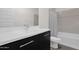 Stylish bathroom featuring sleek vanity with modern fixtures and a shower-tub combination at 3498 E Ravenswood Dr, Gilbert, AZ 85298