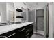 Modern bathroom with dual sinks, granite countertops, and a walk-in shower at 3498 E Ravenswood Dr, Gilbert, AZ 85298