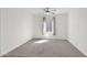 Airy bedroom boasts big windows and soft carpet creating a warm and inviting space at 3498 E Ravenswood Dr, Gilbert, AZ 85298