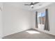 Bedroom featuring a ceiling fan, cozy carpet, and a bright window for natural light at 3498 E Ravenswood Dr, Gilbert, AZ 85298