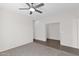 Comfortable bedroom with modern ceiling fan, plush carpet, and airy atmosphere at 3498 E Ravenswood Dr, Gilbert, AZ 85298