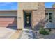 Stunning front entrance with stone accents and modern door at 3498 E Ravenswood Dr, Gilbert, AZ 85298
