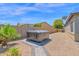 Private backyard oasis featuring a hot tub and low-maintenance gravel landscaping at 3498 E Ravenswood Dr, Gilbert, AZ 85298