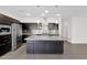 Modern kitchen features dark cabinetry, stainless steel appliances, and granite counters at 3498 E Ravenswood Dr, Gilbert, AZ 85298