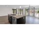 Open kitchen features a center island with sink and seating at 3498 E Ravenswood Dr, Gilbert, AZ 85298